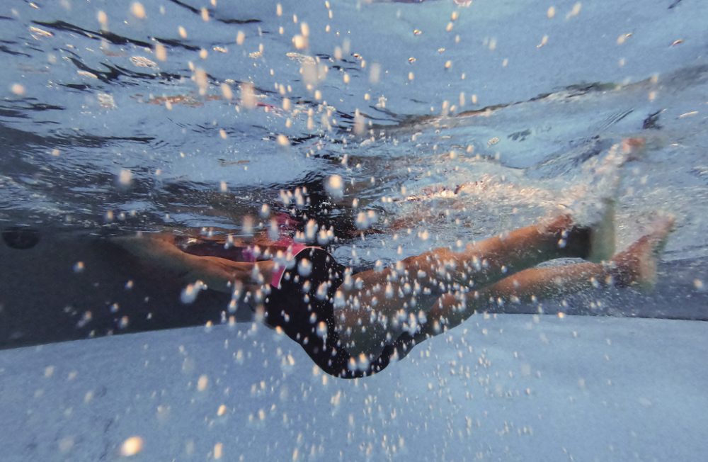 Mary E. Williams, 83 years old, in  the swimming pool of St Mary's recreation center in the Bronx, New York City, USA, on April 12th, 2022. Mary learned to swim when she retired, 22 years ago. "When I was young, we didn't have any place to swim as Black people, she said. Boys would wander around, go to the river and sometimes one would just disappear. It's important to learn to swim because it's also a survival skill! It matters to me that we have a place to swim now. I can't live without water. I started swimming because my doctor said I needed a knee replacement more than 20 years ago. To this day I've never done this surgery. I even put the cane down! I love being the water. I can do more things in the water that I can do on land."