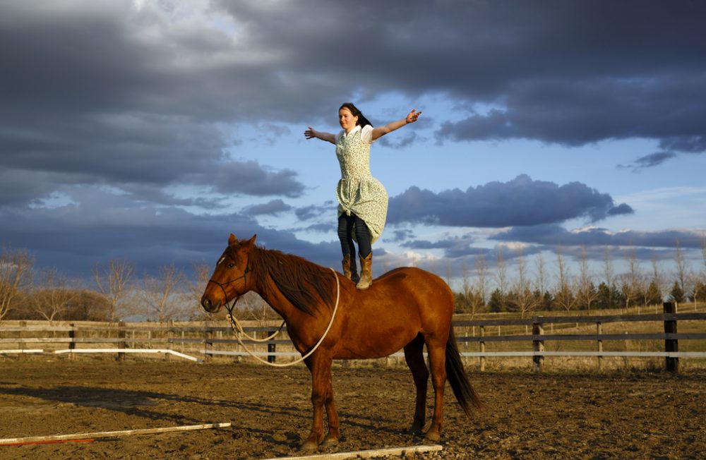 April 20, 2016
Kelly Waldner with her quarter horse mix Kia at Baker Colony on a windy and warm spring evening. Kelly trained horses at Baker before marrying to Green Acres Colony.